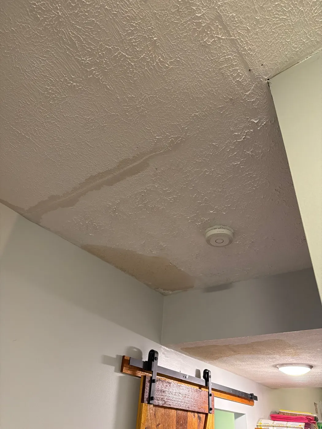 Moisture meter reading on drywall in Mud Creek water loss
